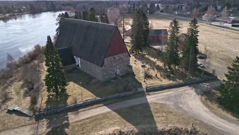 Old-finnish-stone-churh-going-around-with-drone