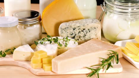 various dairy items arranged on a wooden board