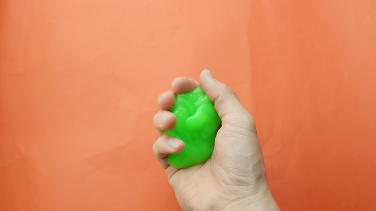 Green slime in person hands, jiggling around, POV