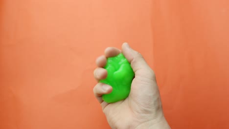 green slime in person hands, jiggling around, pov