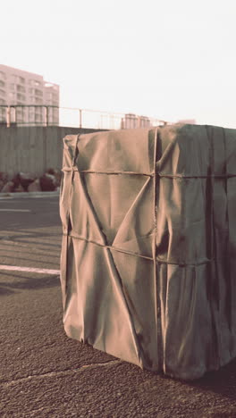 a wrapped package on a street in an urban setting