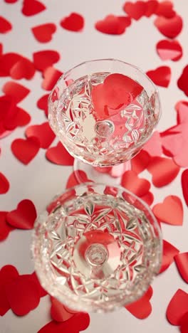 champagne flutes with red hearts for valentine's day