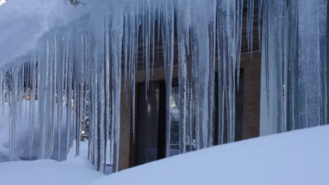 house covered in icicles in harsh winter, nagano japan