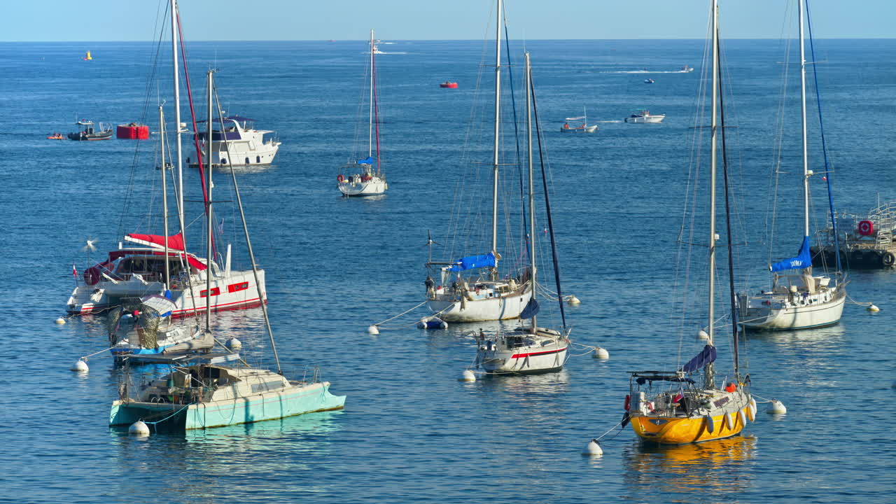 Colourful boats docked in the harbour in Villefranche-sur-Mer, France