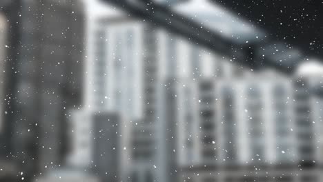 digital composition of snow falling against tall buildings