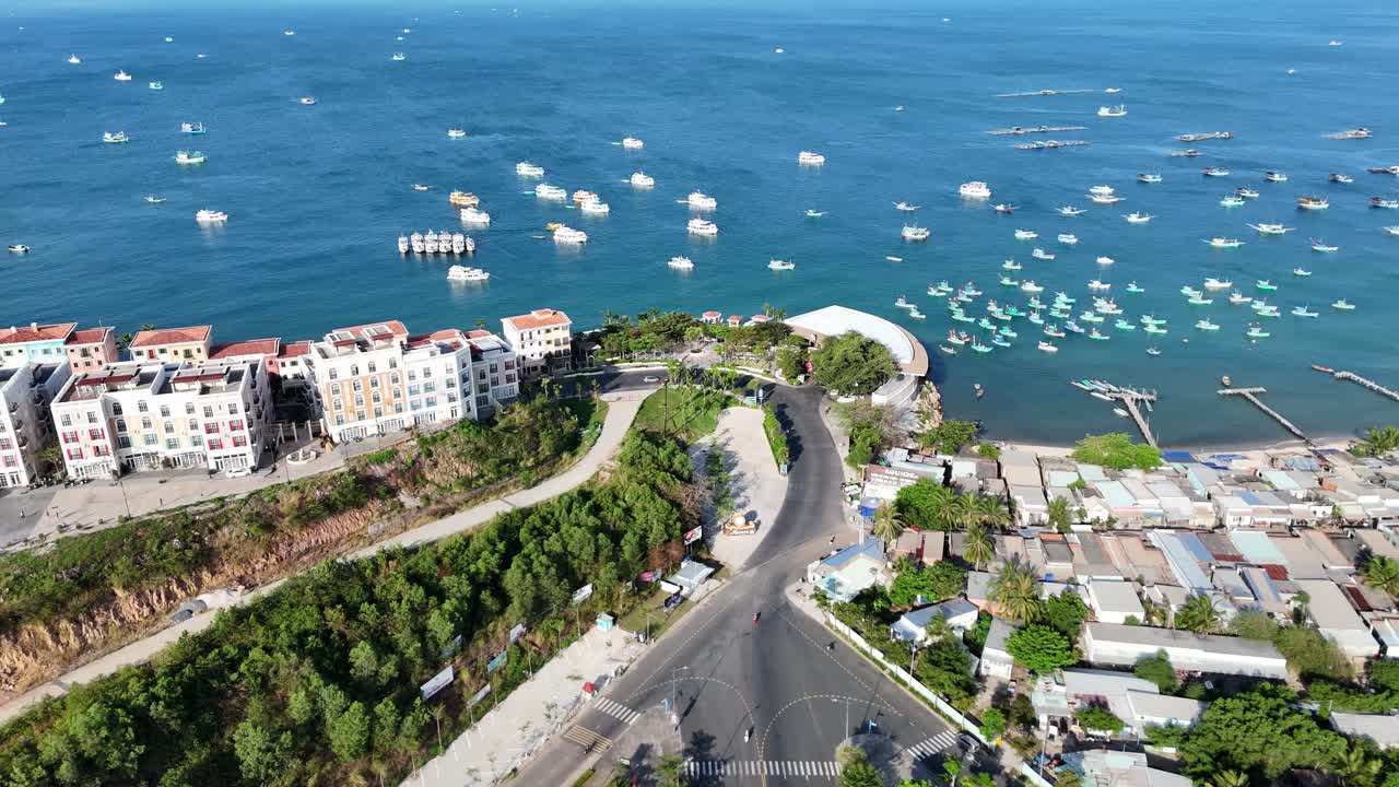 Aerial footage of Kiên Giang Phu Quoc Island, Vietnam. Shows Sunset Town's beautiful Mediterranean setting, and a picturesque harbor filled with a variety of boats and elegant yachts. Drone Video
