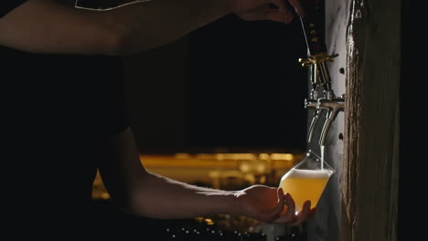 bartender pouring beer