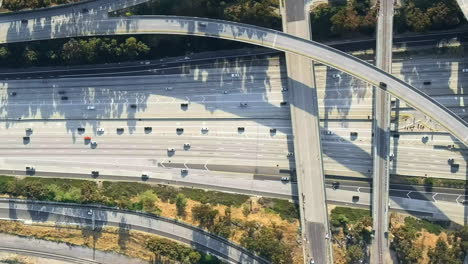 aerial top down, daytime rush hour on north american highway interchange