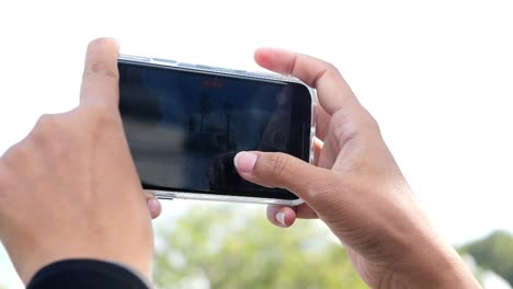 person taking a video with a smartphone