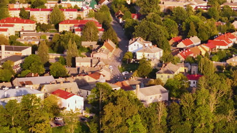 aizpute hotels, attractions, and restaurants; aerial zoom in over a historic town in the courland region of latvia, europe.