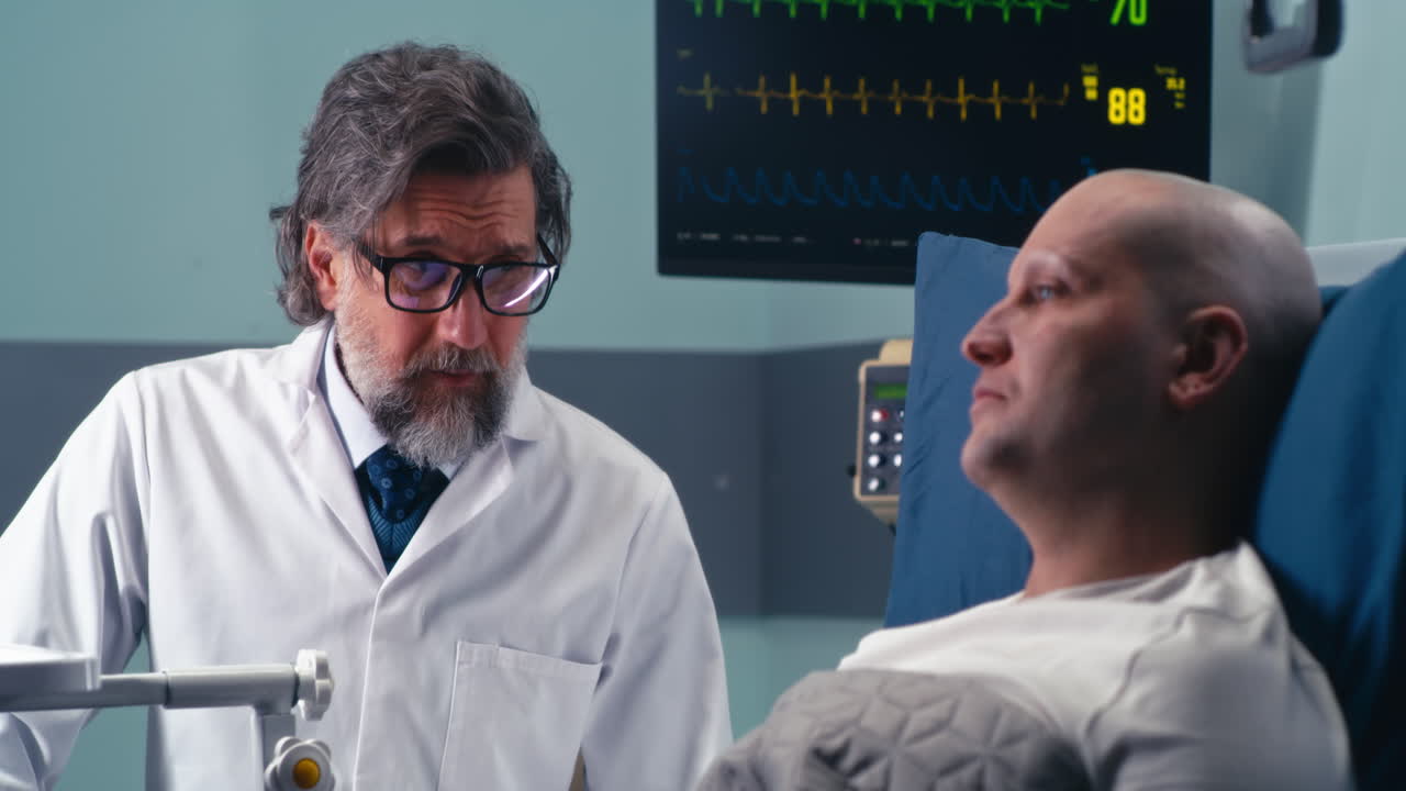 Doctor consults with a patient in hospital