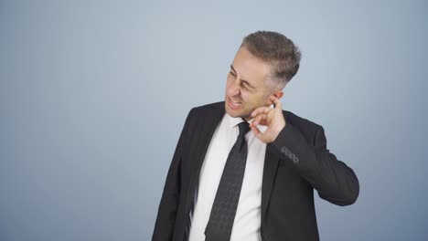 Businessman-scratching-his-ear.