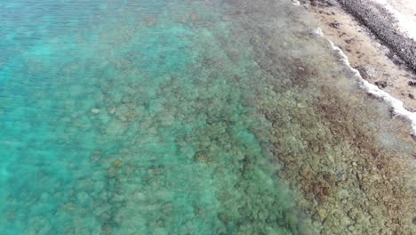 Aerial-Overhead-View-Of-Shallow-Waves-Hitting-Beach-At-Cape-Verde