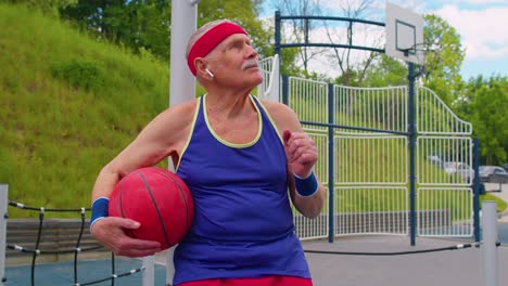 senior man enjoying basketball on a sunny day