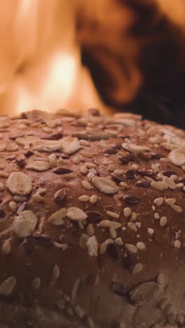 close-up of a seeded bun over a fire