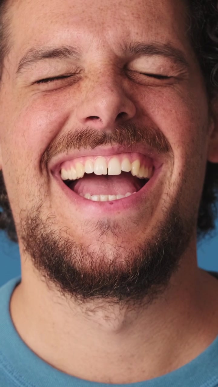 Close-up of a Young Man Laughing and Smiling