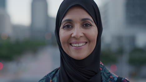 slow motion portrait middle aged muslim woman smiling happy enjoying successful urban lifestyle independent senior female wearing hijab headscarf in city at sunset