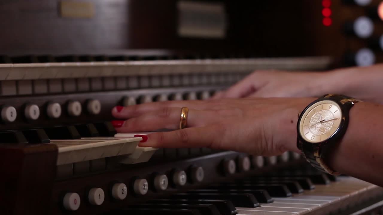 Woman Hands Playing Organ or Piano
