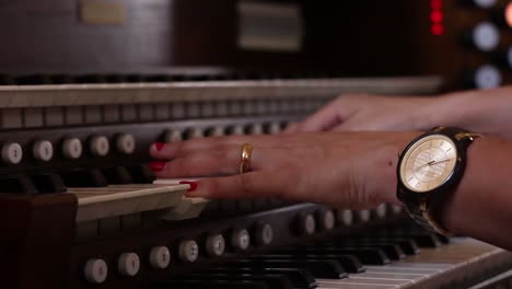 woman hands playing organ or piano
