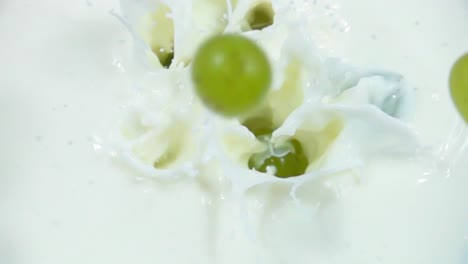 grapes splashing into milk
