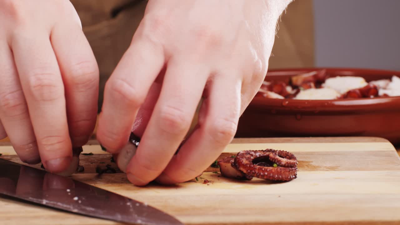 Octopus cooking, chef grill fresh octopus galician style on restaurant kitchen, healthy food, seafood cafe in spain, traditional asian japanese spanish and mediterranean dish.