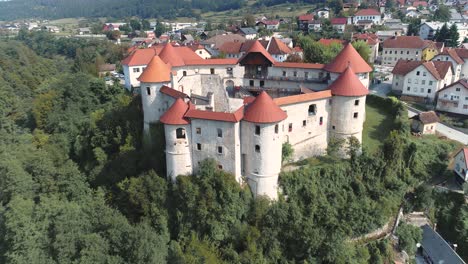 aerial drone shot of zuzemberk castle and krka river