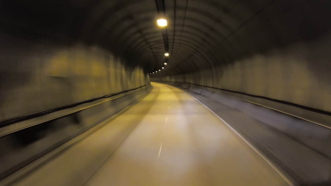 Car rides through the tunnel point-of-view driving