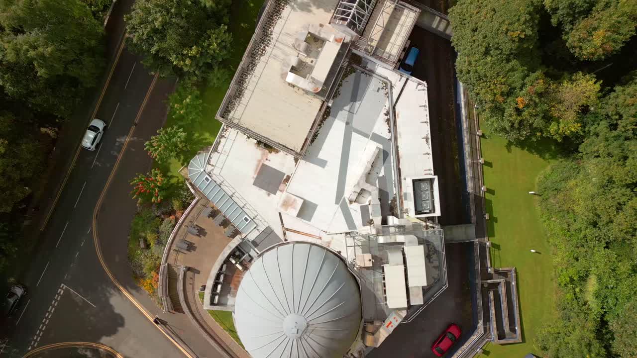 Rising overhead 4K 60FPS aerial of Armagh Planetarium and the surrounding area in Northern Ireland in the UK. Produced with Rec709 color