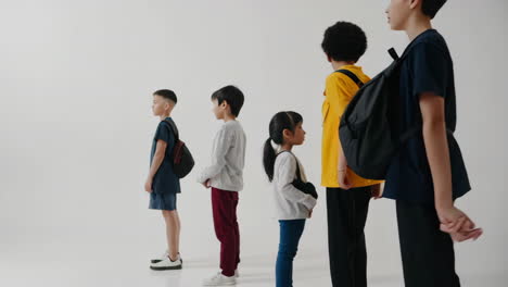 diverse group of people standing in a line, some holding hands