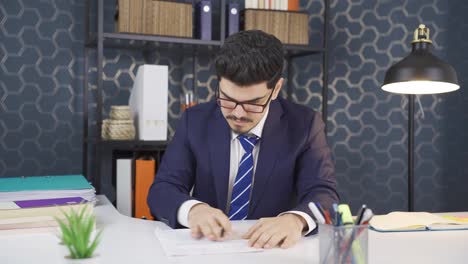businessman signing paperwork.