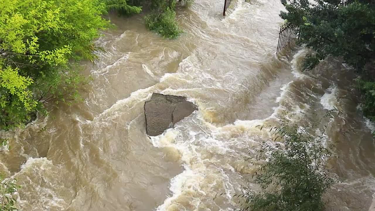Flooding river washing away concrete path, Vaal River Floods South Africa