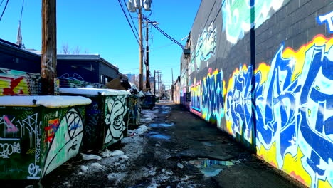 graffiti covered alleyway in denver's rino art district on a bright sunny winter day