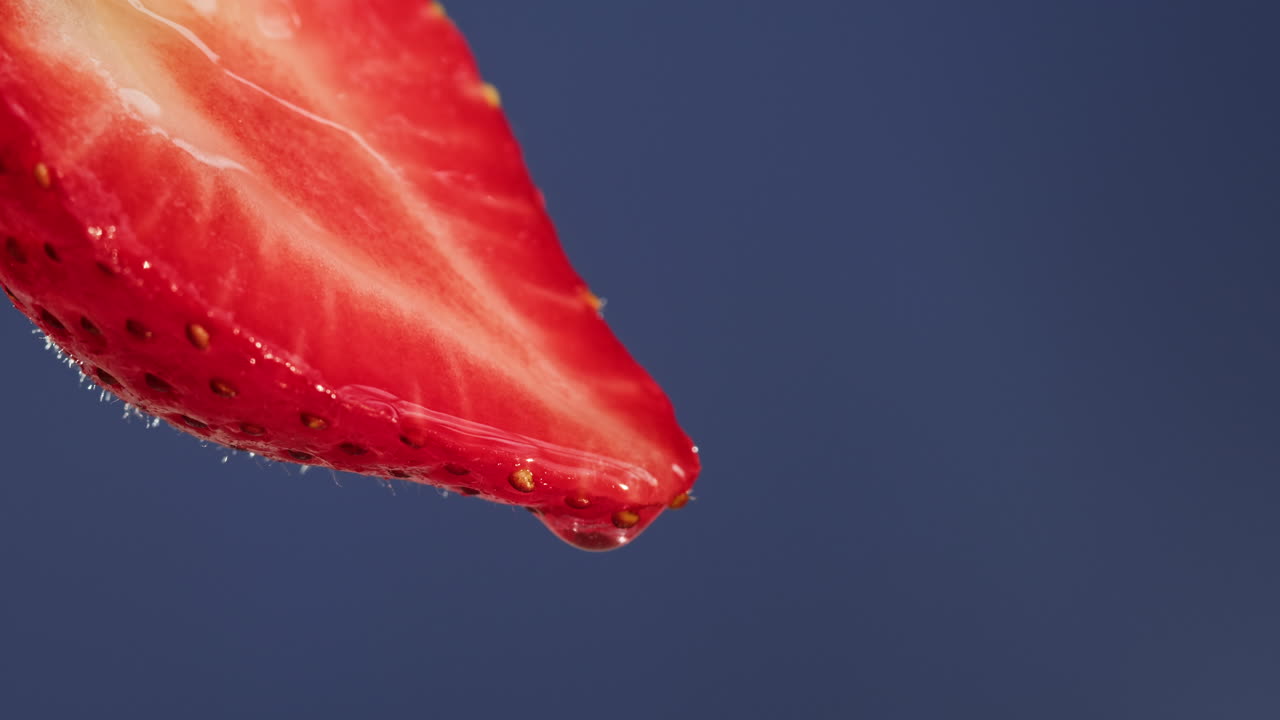 Close-up of a Strawberry Slice with Droplet