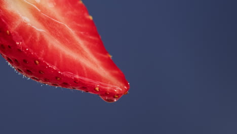 close-up of a strawberry slice with droplet