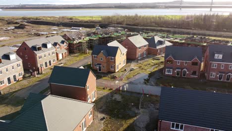 Unfinished-waterfront-townhouse-property-development-construction-site-neighbourhood-aerial-view