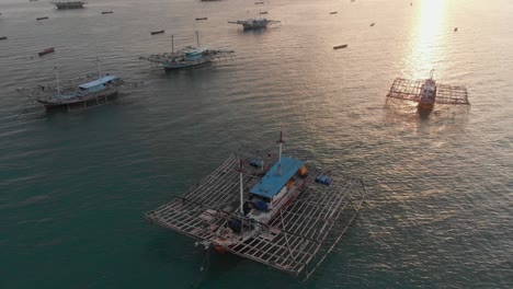 traditional fishing boats docked near tanjung binga at beliting indonesia, aerial