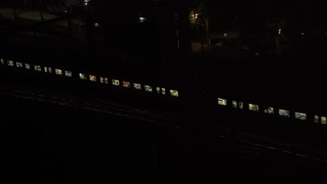 moving metro train on urban railtrack during evening in melbourne, australia
