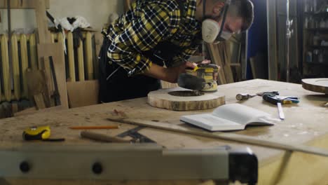 woodworker sanding a tree stump