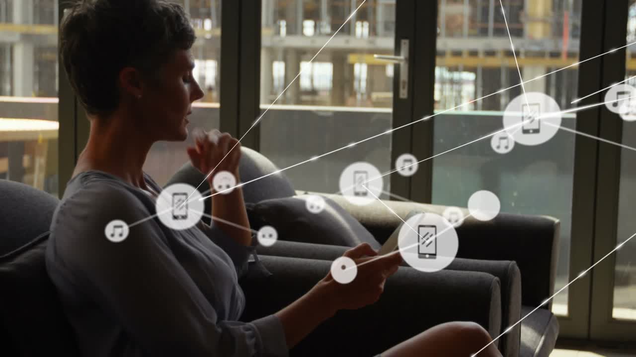 Animation of network of connections with icons over caucasian businesswoman using smartphone