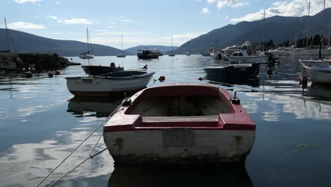 small boats docked at marina at sunset, tivat, montenegro