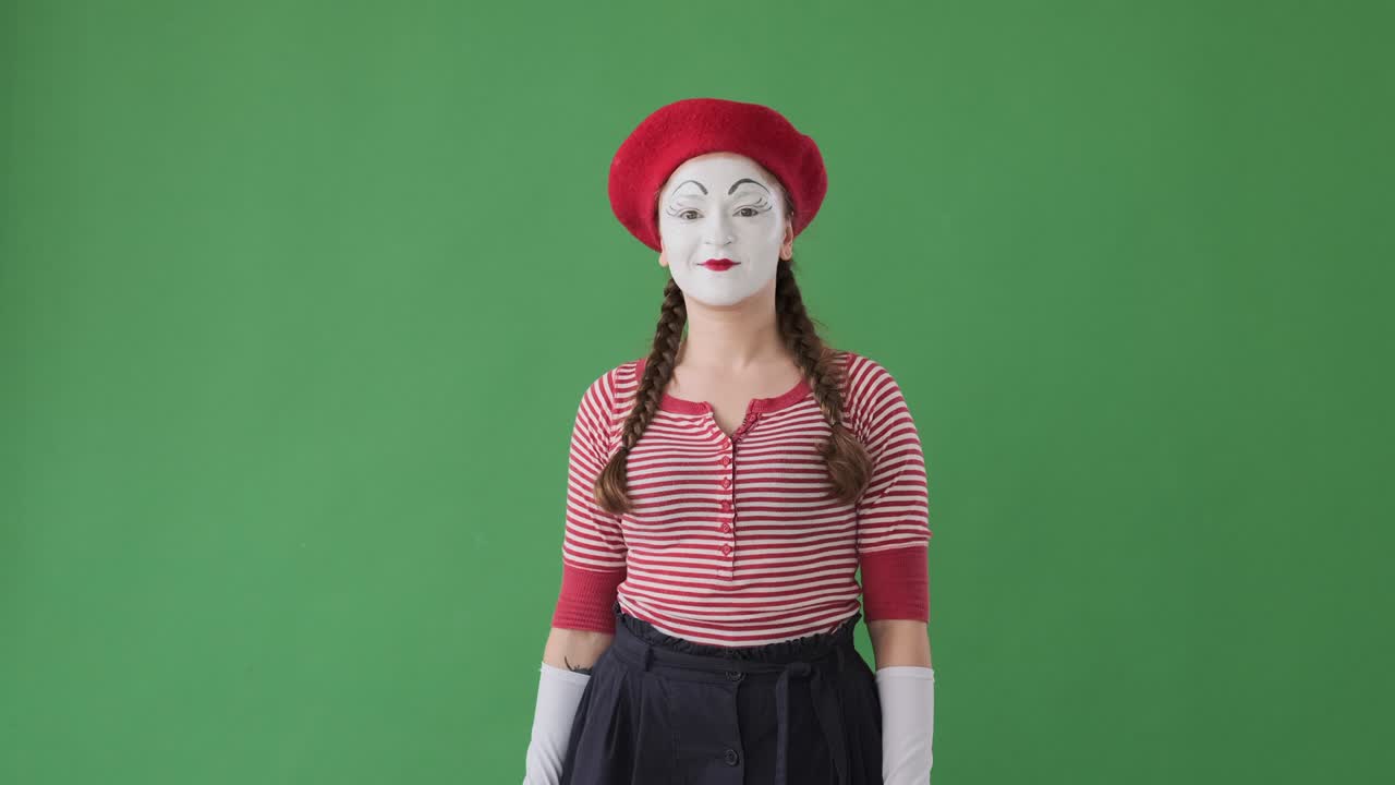 Mime artist giving ok hand sign