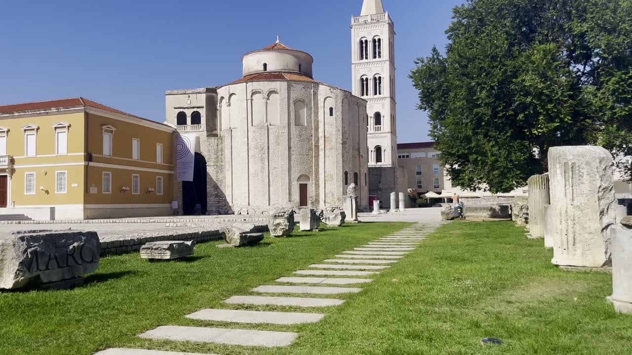 Roman Forum in the city of Zadar on a wonderful quiet sunny summer's day, with Saint Donatus' Church and beautiful stone bell tower - Zadar City Centre, Croatia