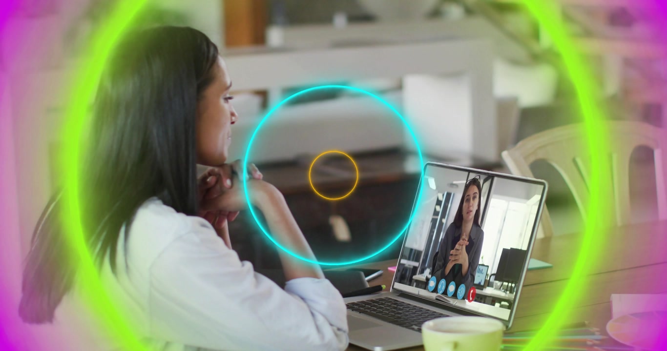 Upon connecting call woman observing laptop with pulsing neon rings highlighting business meeting