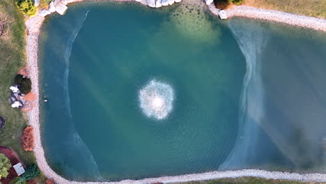 Top-down-aerial-of-water-fountain-in-slow-motion