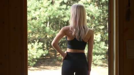 Sporty-Woman-Takes-A-Deep-Breath-And-Getting-Ready-For-A-Jogging-On-A-Breeze-Morning-At-Norwegian-Village-In-Arendel,-Zagorow-Poland