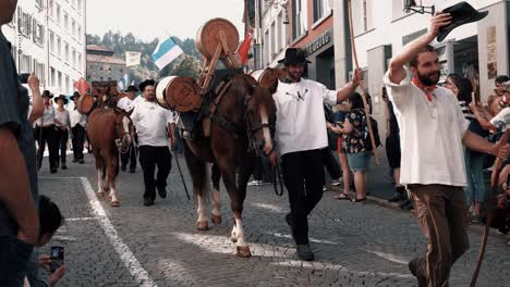 you can see the traditional alpine descent of the cows with the farmers. this is an annual custom in switzerland. taken in einsiedeln.