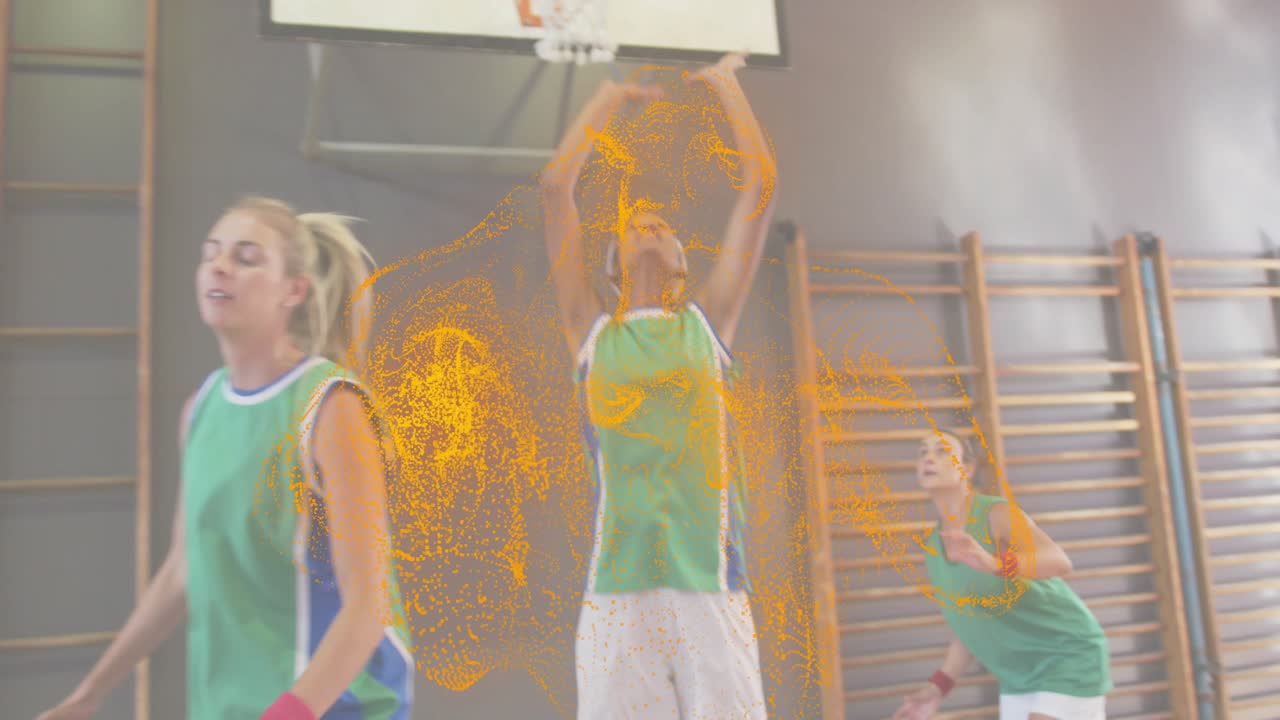 Woman dribbling basketball at key tracing orange swirl passing to teammate launching layup to score