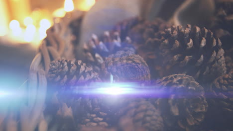 animation of glowing lights moving over fir tree cones christmas decorations