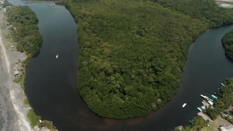 aerial view of el paredon on the bank of rio acome with mangrove forest in guatemala