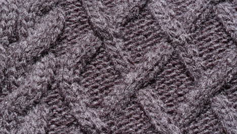 close-up view of dark gray cable knit fabric